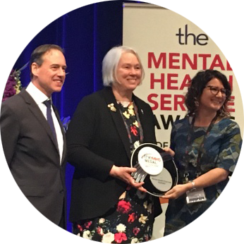 Photo of the MHFA CEO, Deputy CEO and Chairman of the board acception the the prestigious The MHS Medal in 2017
